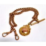 A 9ct ROSE GOLD DOUBLE ALBERT CHAIN with T-Bar and fob, the chain made up of two curb link chains
