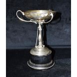 AN ART DECO SILVER TRI HANDLED TROPHY WITH STAND The trophy hallmarked for London 1926 maker D & C