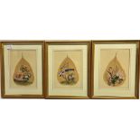 THREE MATCHING CHINESE GOUACHES ON LEAVES each depicting exotic birds amongst foliage, 32cm x 26cm