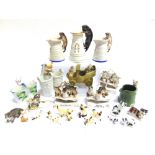 TWENTY-FOUR ASSORTED CAT FIGURINES including Victorian china fairings, the largest 14.5cm high.