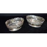 TWO SILVER PEDESTAL BASKETS both of the same openwork design, hallmarked Birmingham 1921and 1926,