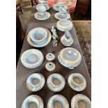 A COLLECTION OF WEDGWOOD JASPERWARE DINNERWARE with white sprigged decoration on a blue ground