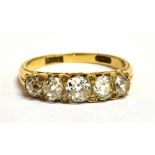 A STAMPED 18CT EUROPEAN CUT DIAMOND FIVE STONE BOAT RING The five graduated diamonds measuring 3-4mm