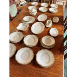 A COLLECTION OF KPM 'ROYAL IVORY' DINNERWARE with shaped gilt borders, including plates, bowls,