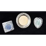 THREE SILVER FRONTED MINIATURE PICTURE FRAMES Circular of plain form, hallmarked for Birmingham