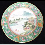 A GROUP OF FIVE CHINESE PLATES comprising one painted with buildings, figures and a boat in a