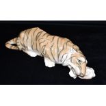 PETER HEROLD FOR ROYAL COPENHAGEN: a large figure of tiger feasting in recumbent pose, model 2065,