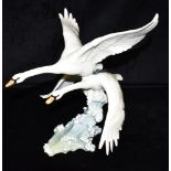 A LARGE GERMAN HUTSCHENREUTHER PORCELAIN GROUP OF A PAIR OF GEESE IN FLIGHT approx 33cm long,