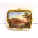 CIRCA 1900 PAINTED CERAMIC BROOCH The brooch featuring painted scenery on ceramic and mounted in