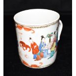 A CHINESE EXPORT PORCELAIN TANKARD polychrome enamelled with figures, naturalistic twig handle, 11.