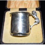 A CASED VINTAGE SILVER CHRISTENING MUG the mug with a figural rabbit fashioned as a handle,