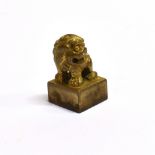 A CASED CHINESE GILT METAL SEAL modelled as a dog of Fo, 23mm high