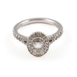 BOXED AND CASED VERA WANG LOVE 18KT DOUBLE HALO RING the white gold ring set with an oval diamond