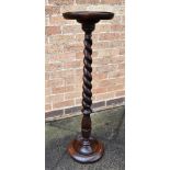 AN OAK PLANT STAND the circular top 29cm diameter, on spiral stem, 101cm high Condition Report :
