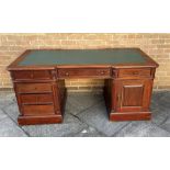 A LARGE HARDWOOD TWIN PEDESTAL DESK with three frieze drawers, one pedestal fitted with three
