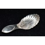 A SILVER CADDY SPOON Hallmarked for Sheffield, date letter W, maker T.B & S, length 8.5cm