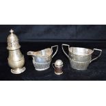 A COLLECTION OF SILVERWARE comprising a twin handled sugar bowl, a creamery, a sifter, pepper pot