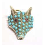 A TURQUOISE STONE SET FOX HEAD PENDANT PIECE The fox head backed in unmarked yellow metal with the