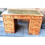 A FRUITWOOD TWIN PEDESTAL DESK with gilt tooled green leather top, 139cm wide 76cm deep 78cm high