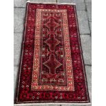 A NORTH EAST PERSIAN MESHED BELOUCH RUG 195cm x 103cm Condition Report : good condition Condition