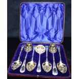 A CASED SET OF GEORGIAN SILVER BERRY SPOONS AND STRAINER The six Berry spoons hallmarked for
