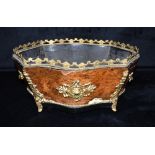A FRENCH GILT METAL MOUNTED KINGWOOD CACHE POT of serpentine form, 36cm wide Condition Report :