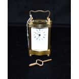 A FRENCH BRASS CASED CARRIAGE CLOCK the enamel dial signed 'Rapport Fonde en 1900 France', 13cm high