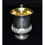 AN ANTIQUES SILVER GILT PEDASTAL CUP The cup of plain form with embossed flowers to the lower