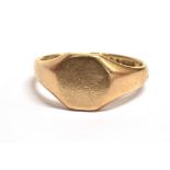 A 9CT GOLD SIGNET RING The ring with hexagonal bezel measuring approx. 0.9cm the shank with rubbed