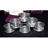 SIX MATCHING SILVER NAPKIN RINGS The napkin rings with silver leaf etched pattern, all with