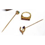 THREE ITEMS OF JEWELLERY a 9ct gold wishbone stick pin set with a blue paste stone, hallmarked for