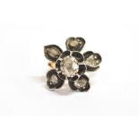ANTIQUE DIAMOND SIX STONE BUTTERCUP RING The large flower head ring in evolved Buttercup setting,