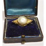 A BOXED LATE 19TH CENTURY LARGE BLISTER PEARL BROOCH the pearl measuring 1.7cm in diameter, set in