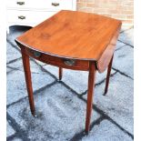 A VICTORIAN MAHOGANY PEMBROKE TABLE the oval top 53cm wide (97cm with both leaves extended) 74cm