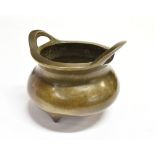 A SMALL CHINESE BRONZE TWIN HANDLED CENSER on three prong feet, bearing six character Xuande mark to