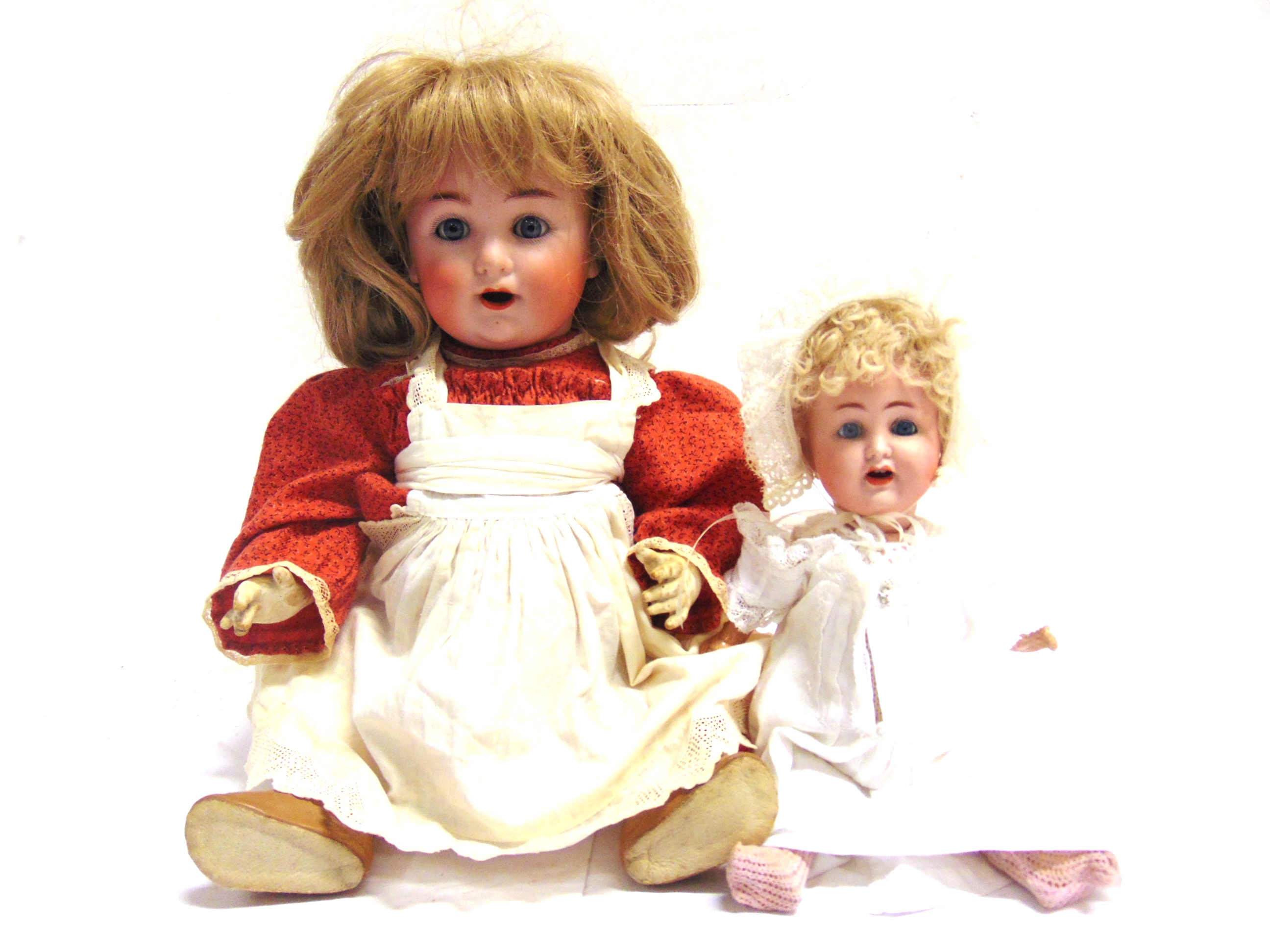 TWO BISQUE DOLLS comprising a John Bing [S. & Q.] bisque socket head doll, with a replacement