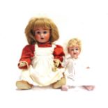 TWO BISQUE DOLLS comprising a John Bing [S. & Q.] bisque socket head doll, with a replacement