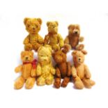 SEVEN SMALL MOHAIR & GOLD PLUSH TEDDY BEARS the largest 17cm high (one lacking one eye).