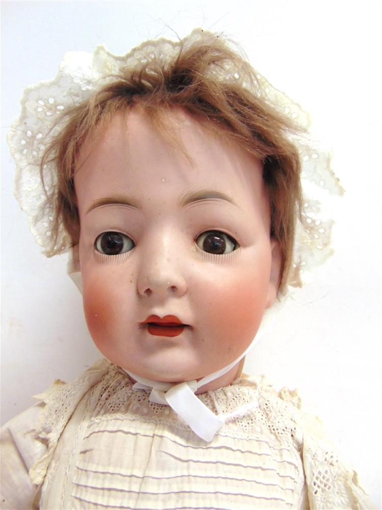 A KONIG & WERNICKE BISQUE SOCKET HEAD DOLL with a cropped brown wig, sleeping brown glass eyes, - Image 2 of 2