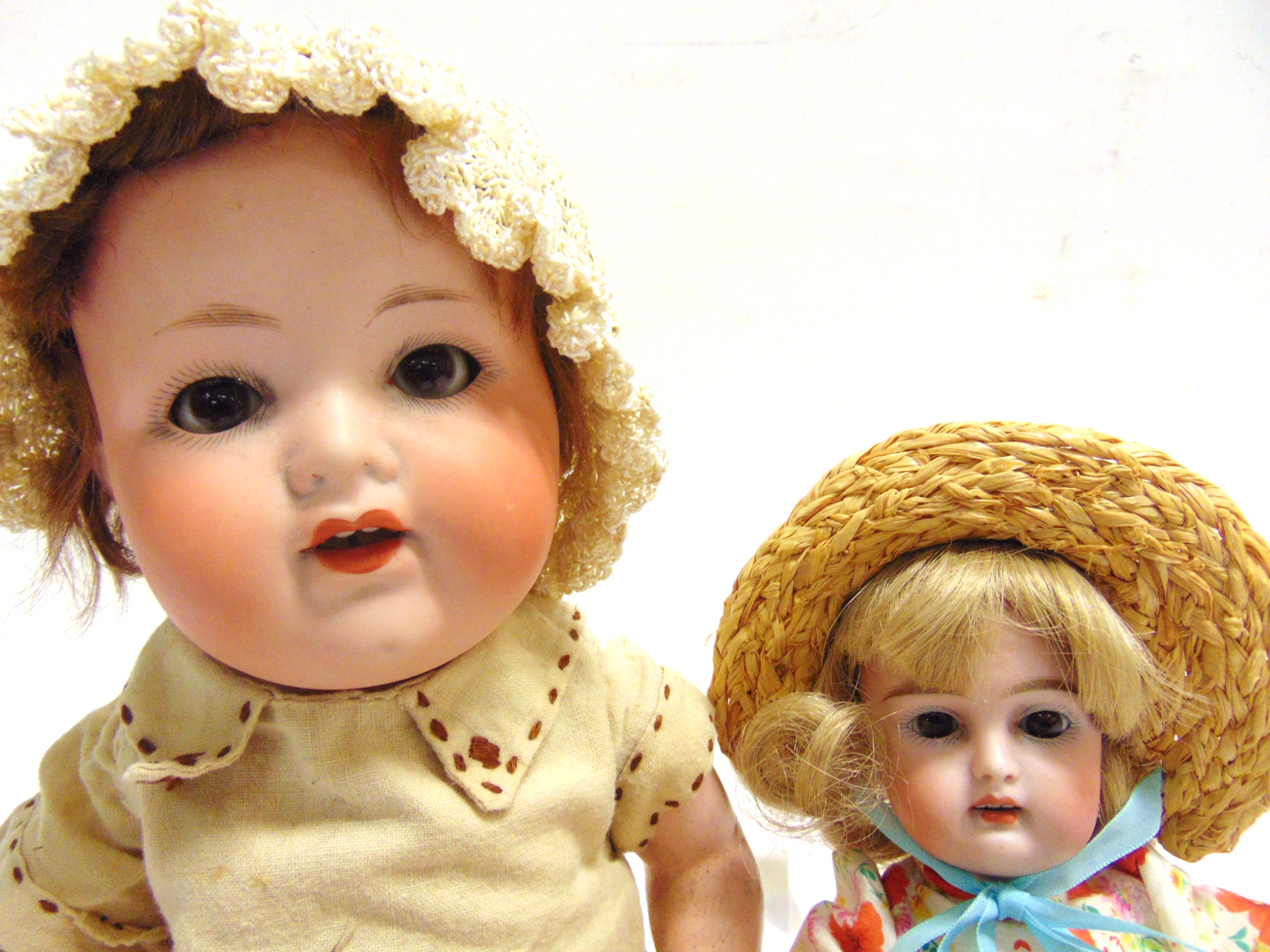 TWO BISQUE DOLLS comprising an Armand Marseille bisque socket head doll, with a cropped brown wig, - Image 2 of 2