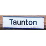 A MODERN ERA STATION SIGN, 'TAUNTON' of pressed aluminium, with upper and lower flanged edges, 33.