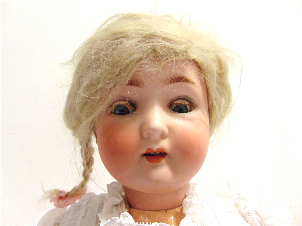 A SCHOENAU & HOFFMEISTER BISQUE SOCKET HEAD DOLL with a plaited blonde wig, sleeping blue-grey glass - Image 2 of 2