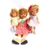 THREE IDEAL TOY CO. SHIRLEY TEMPLE COMPOSITION DOLLS each with a jointed body, 55cm, 33cm and 31cm