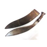A LARGE KUKRI the 48.5cm typically curved blade with two narrow fullers to the back edge and