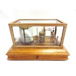 A BAROGRAPH, WILSON, WARDEN & CO. LTD, LONDON serial no. 5496/46, in a glazed wood case with