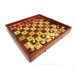 A JAQUES & SON [LONDON] IN STATU QUO CHESS SET with natural white and stained red bone playing