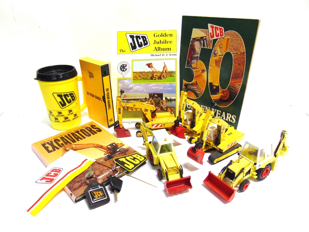 A JCB COLLECTION comprising five diecast model vehicles by NZG (2) and Matchbox (3), variable