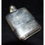 AN EDWARDIAN SILVER HIP FLASK the flask of plain form with engraved initials, the curved flask