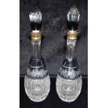 A PAIR OF SILVER MOUNTED GLASS DECANTERS AND STOPPERS with flash cut floral decoration, 39.5cm