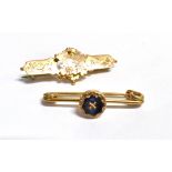 TWO EARLY 20TH CENTURY BROOCHES A 9ct gold bar brooch, with applied and engraved floral design,